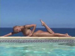 TubeBigCock presents: Blonde strips from bikini and takes a dip